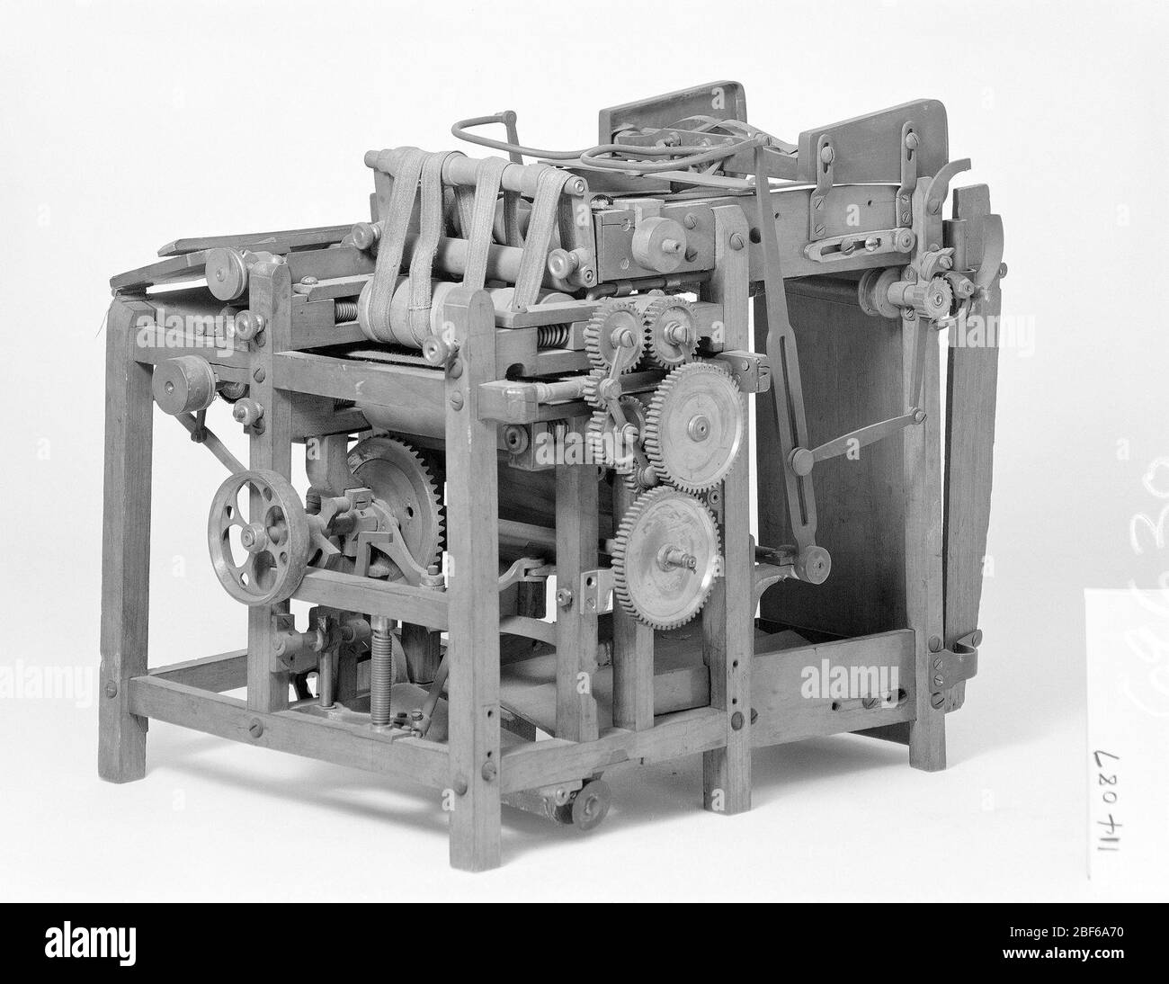 Patent Model of a Sheet Feed Apparatus for Bookbinding. This patent model demonstrates an invention for a sheet-feed apparatus which was granted patent number 114087. Stock Photo