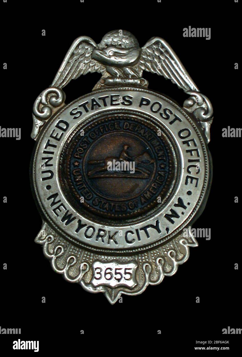 Administrative employee chest badge number 3655. . Post Office Department  chest badge, number 3655, with vertical hinged pin and safety clasp on  verso Stock Photo - Alamy