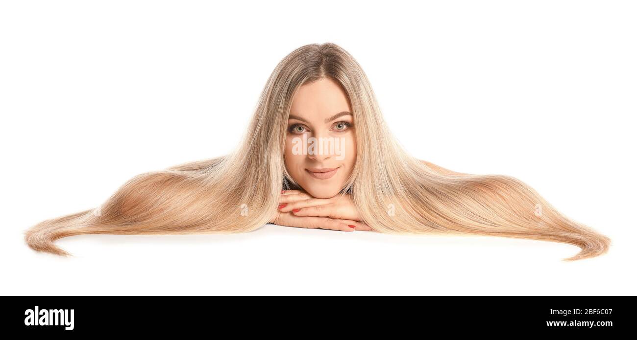 Beautiful young woman with long hair on white background Stock Photo ...