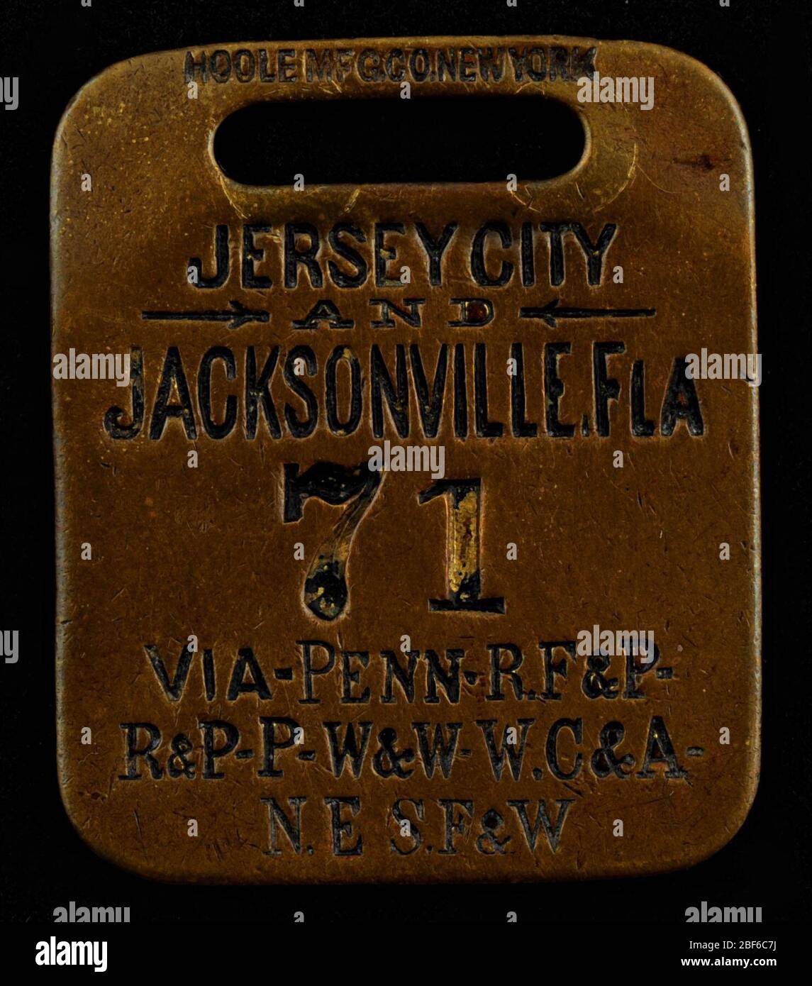 Eastern Seaboard Trip Owney tag. This tag marks Owney’s travels on a series of small railway lines between Jersey City, New Jersey, to Jacksonville, Florida. Among the lines Owney traveled were the Pennsylvania and the Richmond, Fredericksburg and Potomac Railroad. Stock Photo