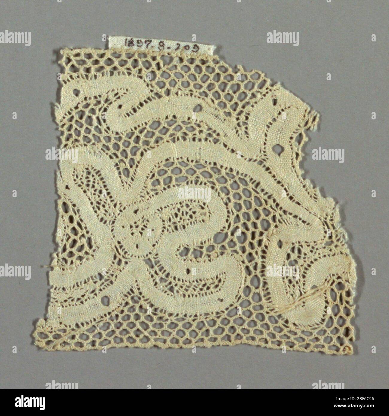 Fragment. Wavy ribbon like floral design. Hexagonal mesh ground Stock ...