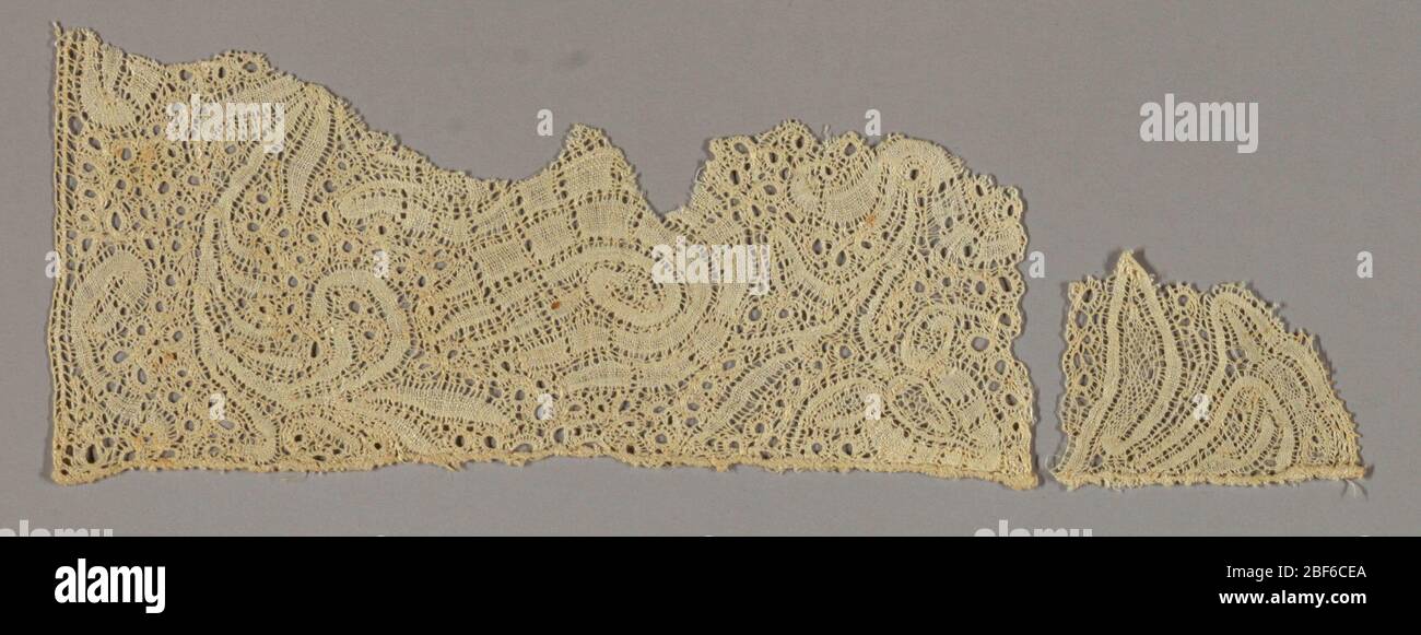 Fragment. Scrolling ribbon like floral design. Ground with small scale ...