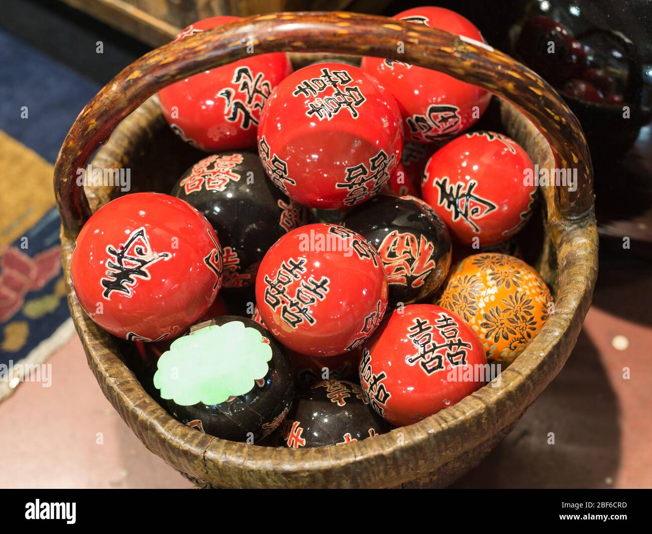 Group of Colorful Japanese HandPainted Spheres inside a Basket Stock
