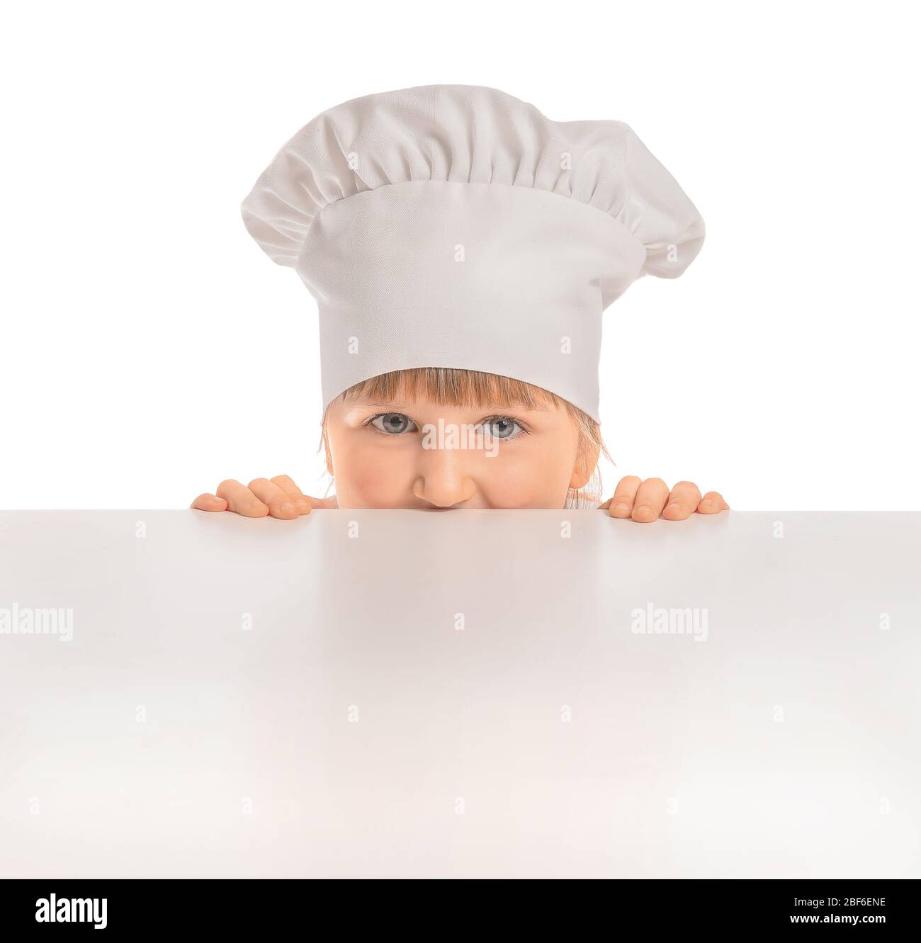 Cute little chef with blank poster on white background Stock Photo - Alamy