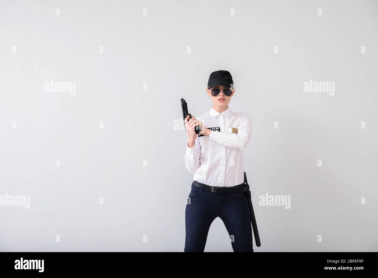 Young police woman service weapon hi-res stock photography and images ...