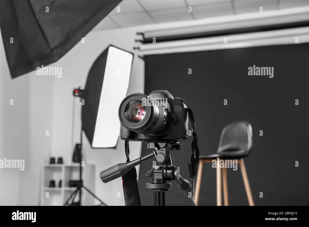 Modern camera in professional photo studio Stock Photo - Alamy