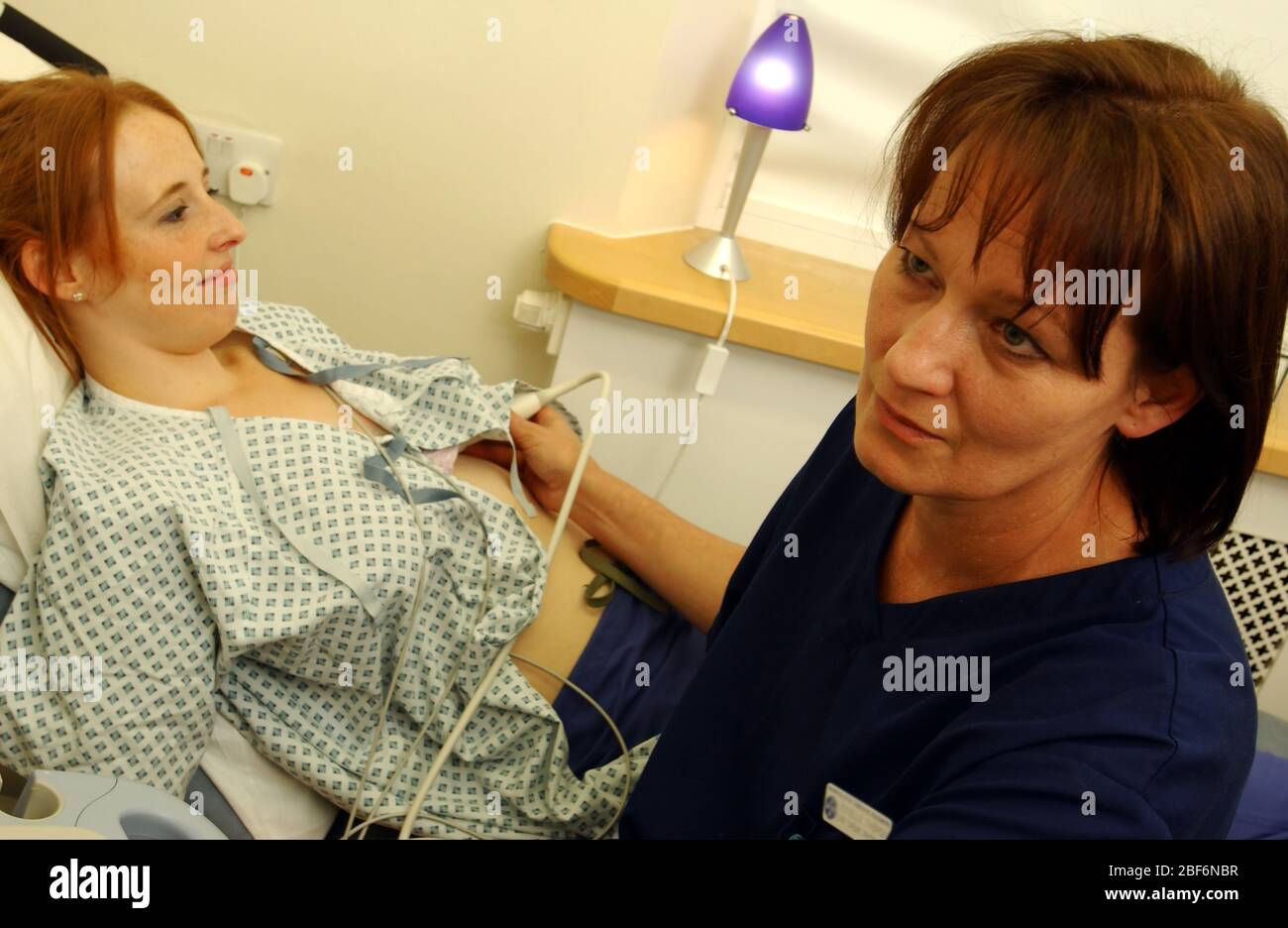 Close up of a cardiophysiologist scanning her patient for any heart defects Stock Photo