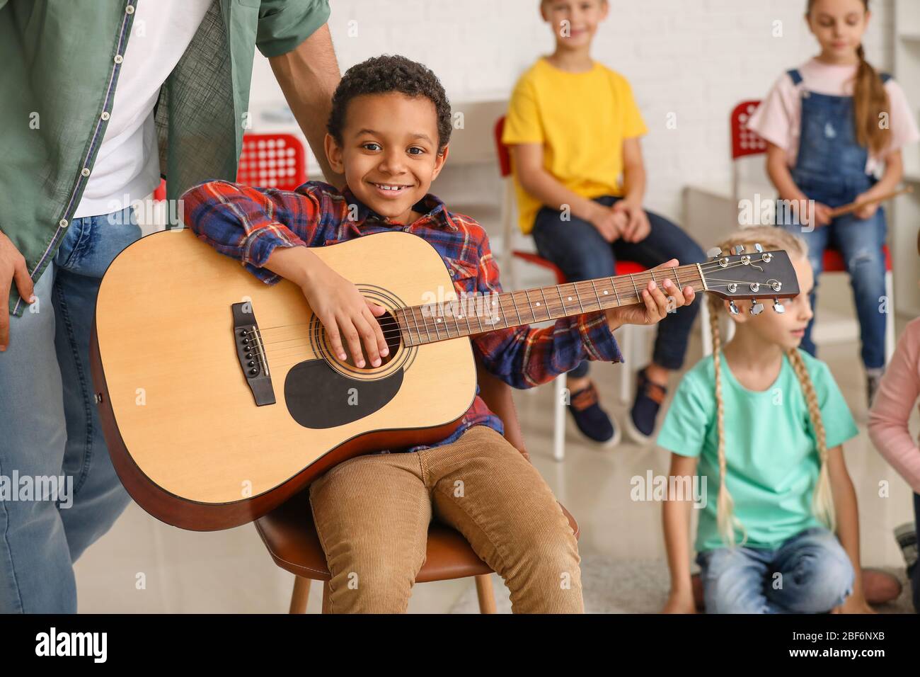 teacher-giving-music-lessons-at-school-stock-photo-alamy