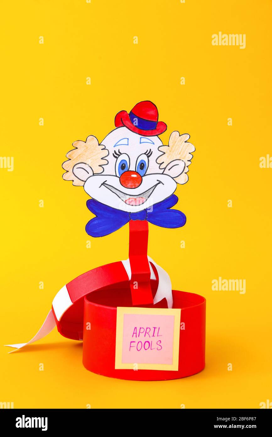 Surprise box on color background. April Fool's Day prank Stock Photo ...