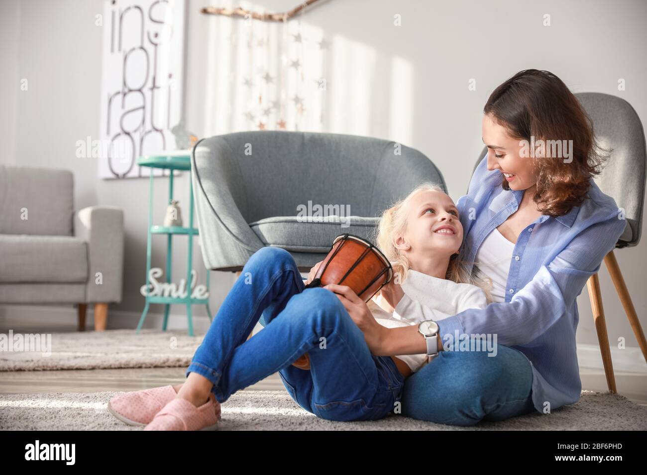 Private music teacher giving lessons to little girl at home Stock Photo ...