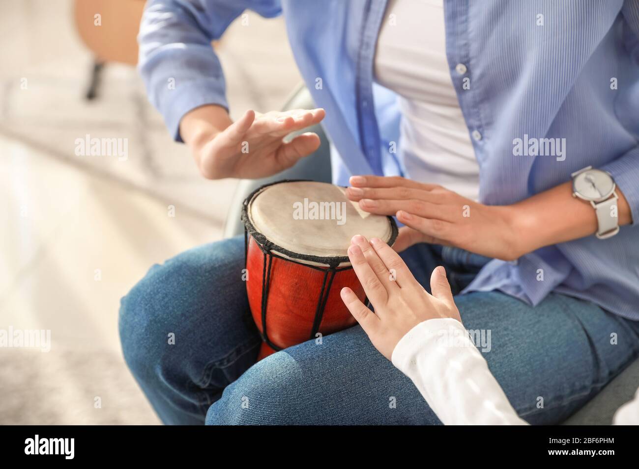 Private music teacher giving lessons to little girl at home Stock Photo ...