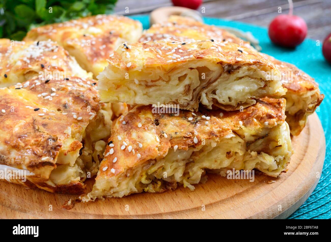 Burek Turkish pie. Lavash puff pie with cheese and sesame seeds Stock Photo