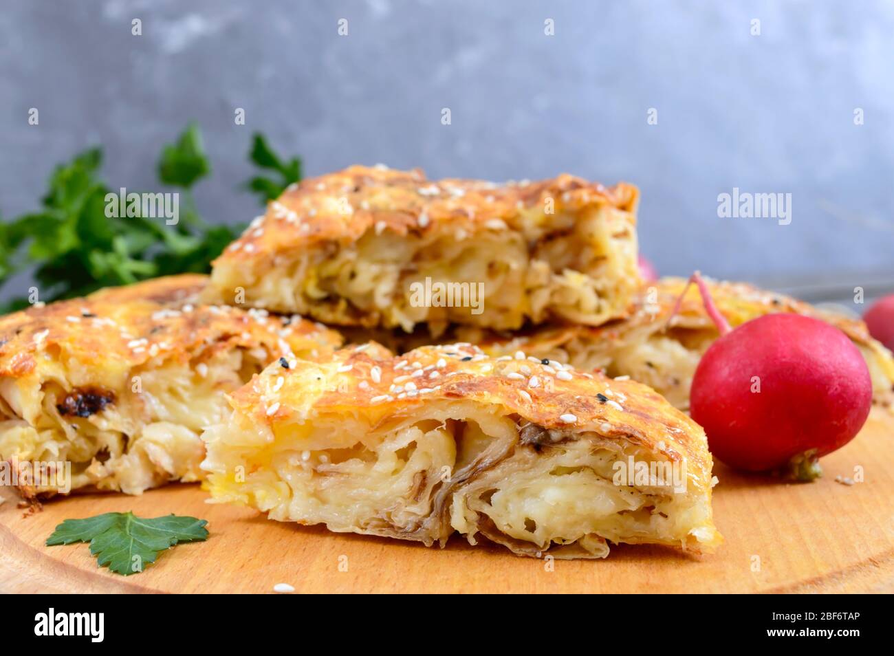 Burek Turkish pie. Lavash puff pie with cheese and sesame seeds Stock Photo
