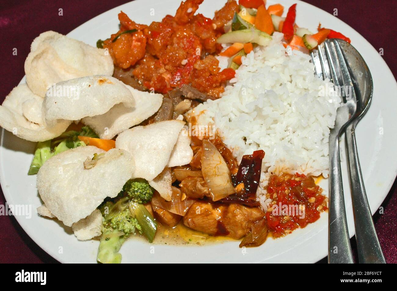 Authentic Indonesian rice meal, Nasi rames Stock Photo - Alamy