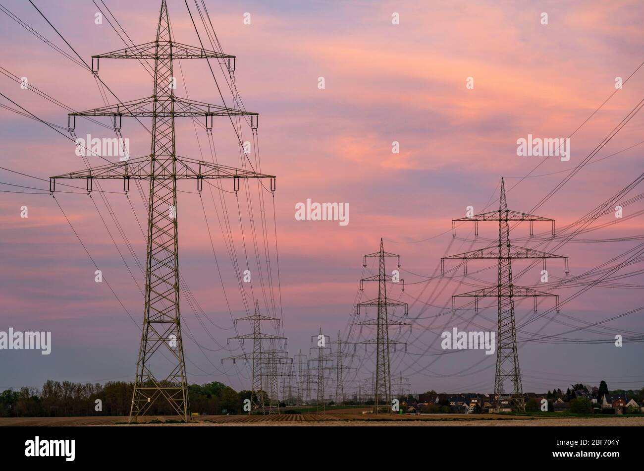 Extra-high voltage lines, 380 KV, power line, the electricity comes from the Rhenish lignite mining area, at the Neurath power plant, near Grevenbroic Stock Photo