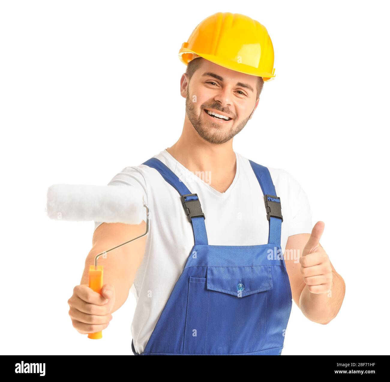 Young painter showing thumb-up on white background Stock Photo