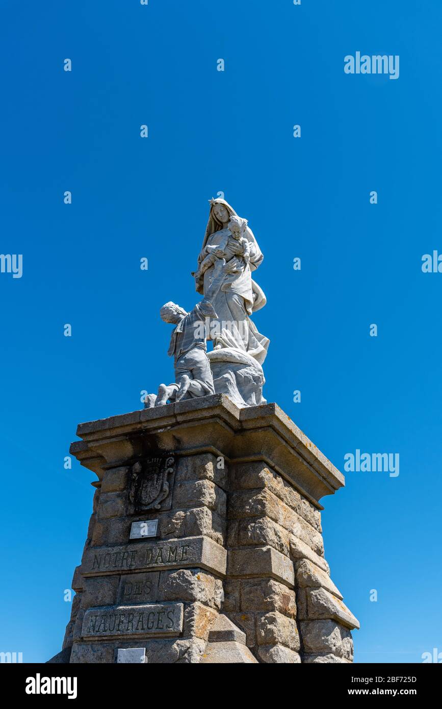 Pointe du Raz, France - August 2, 2018: Monument of Notre Dame des Naufrages (Our Lady of shipwrecks) against blue sky Stock Photo