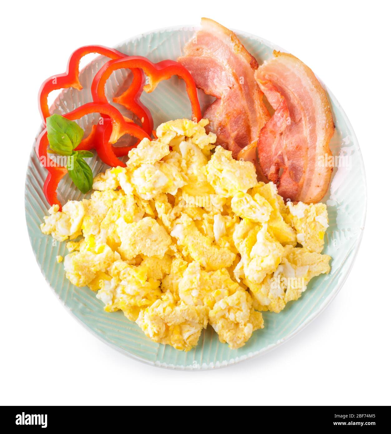 Plate with scrambled egg and bacon on white background Stock Photo - Alamy