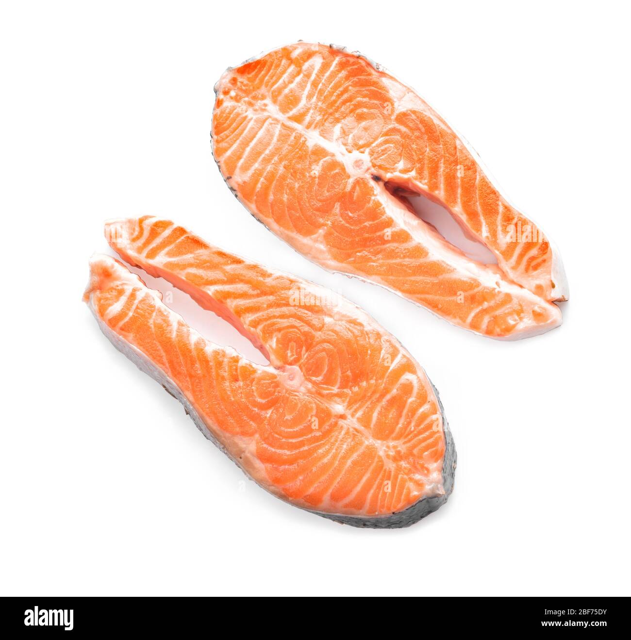 Raw salmon steaks on white background Stock Photo - Alamy