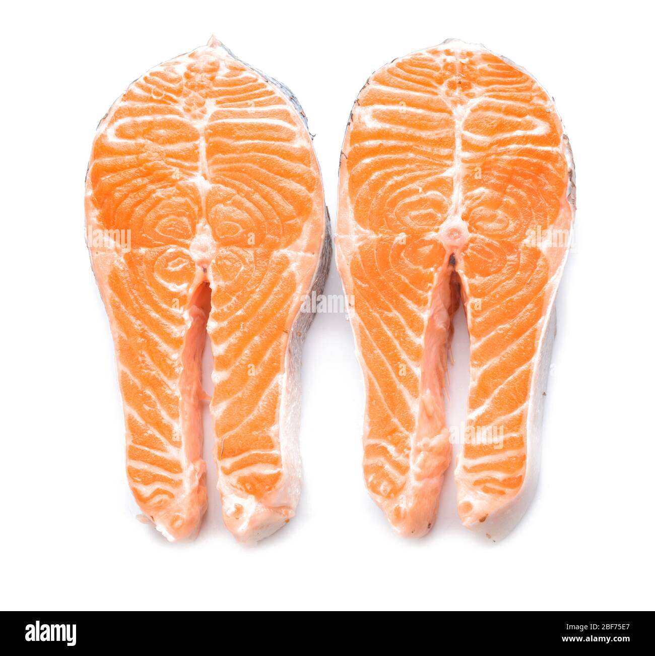 Raw salmon steaks on white background Stock Photo - Alamy