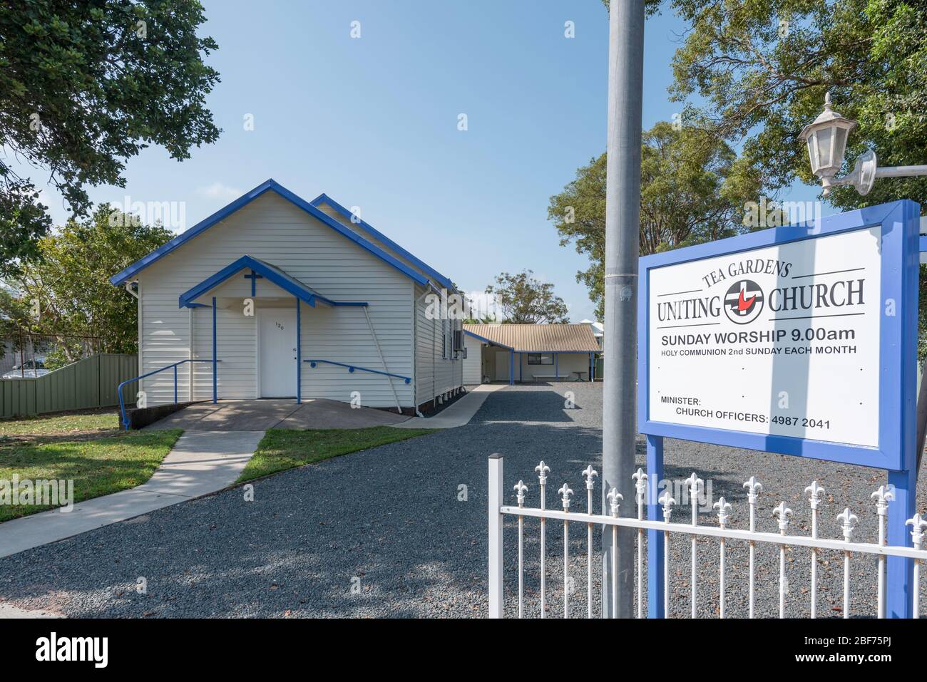 The freshly painted blue and white Uniting Church in Tea Gardens, New