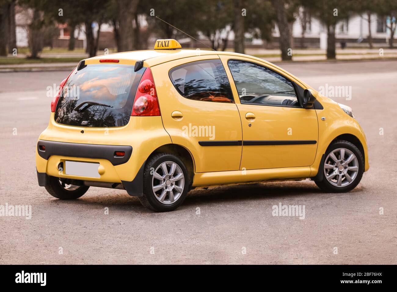 Modern taxi car on city road Stock Photo