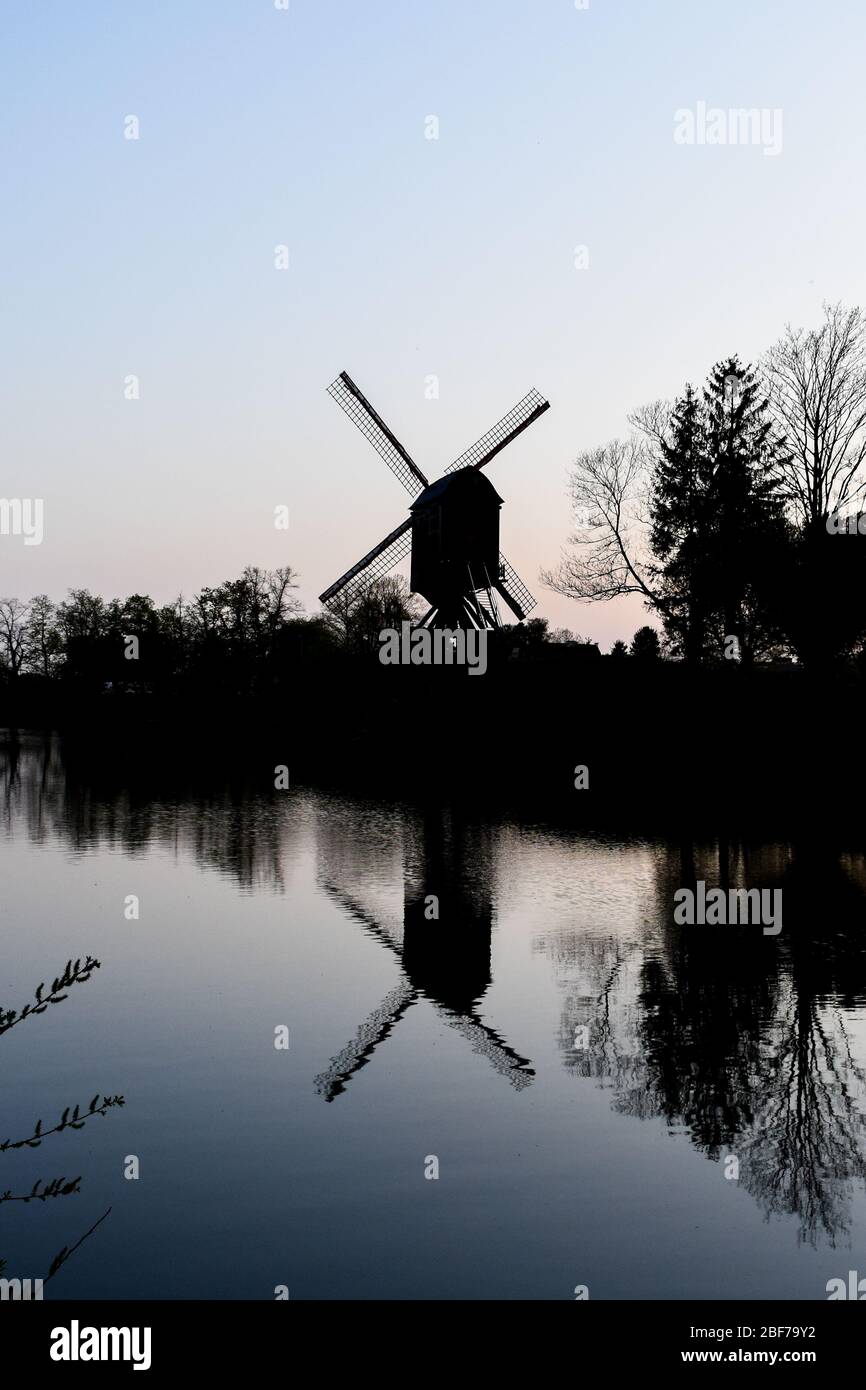 An old windmill that was used for grinding grain to make bread... Stock Photo