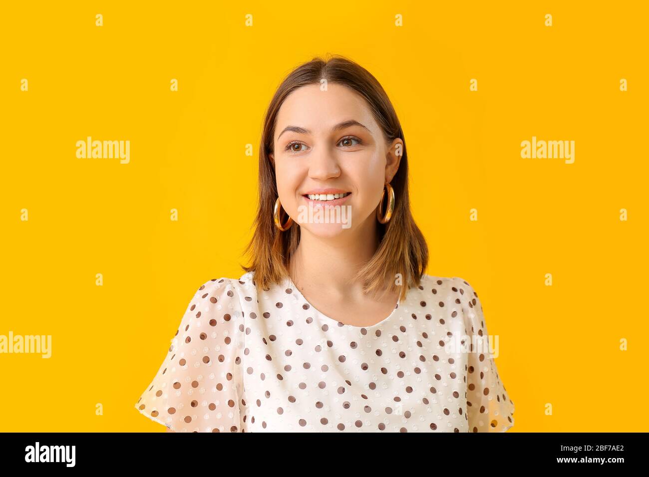Portrait of beautiful young woman on color background Stock Photo - Alamy