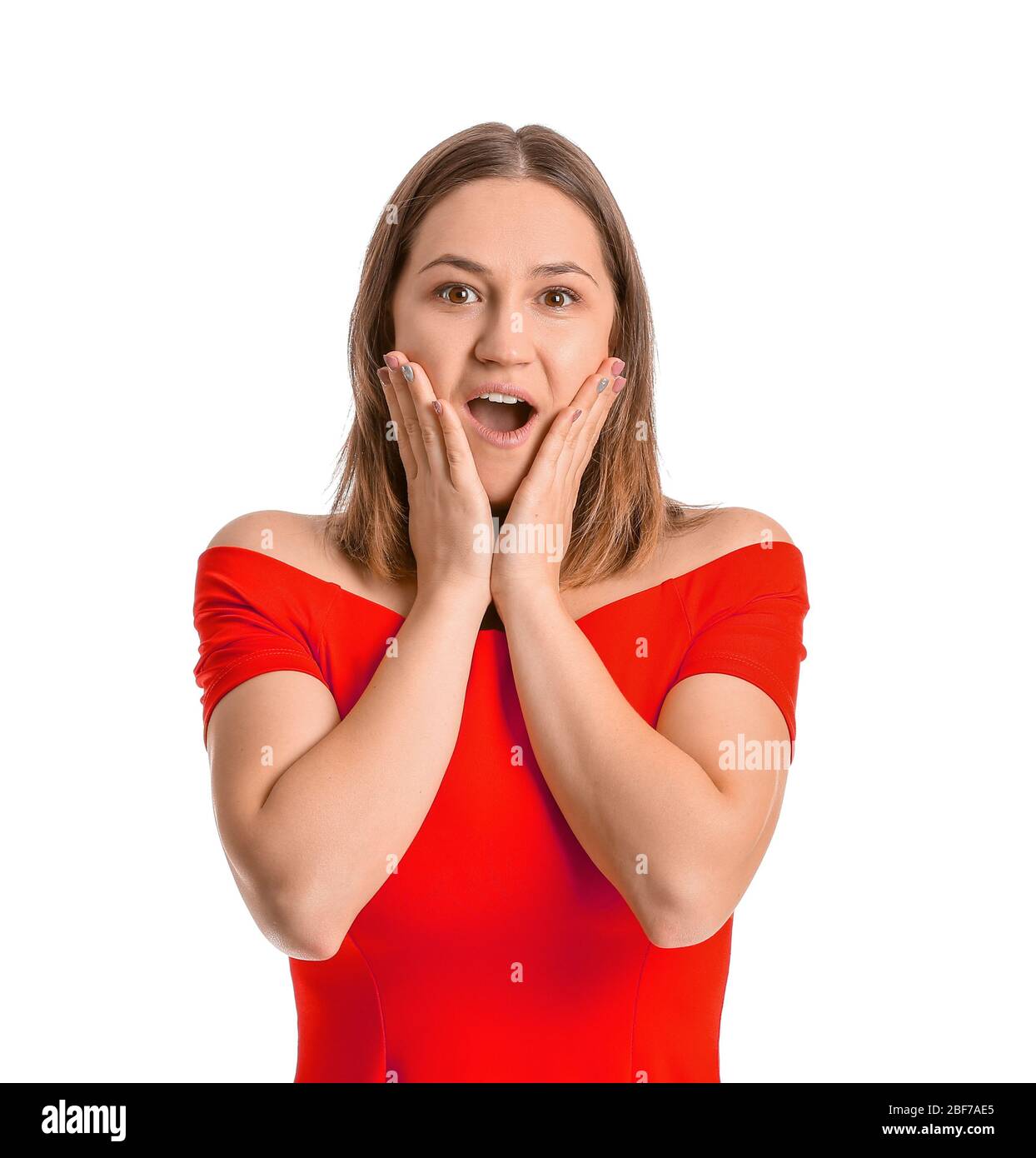 Surprised young woman on white background Stock Photo - Alamy