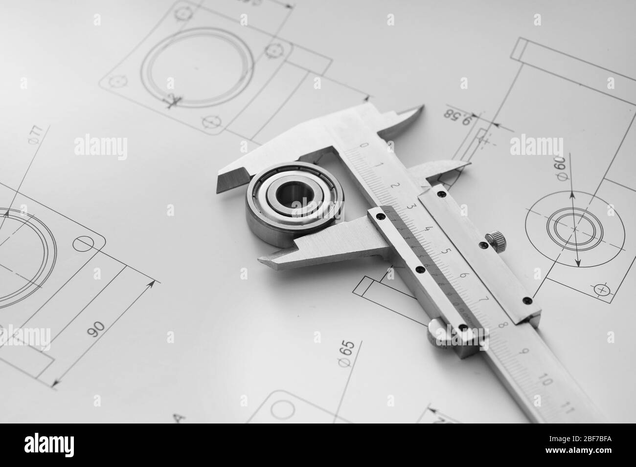 Bearing with vernier caliper and drawings on table of engineer Stock Photo Alamy