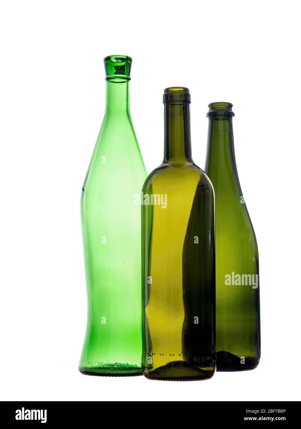 Various green glass wine bottles, empty. Isolated on white background. Three objects still life. Stock Photo