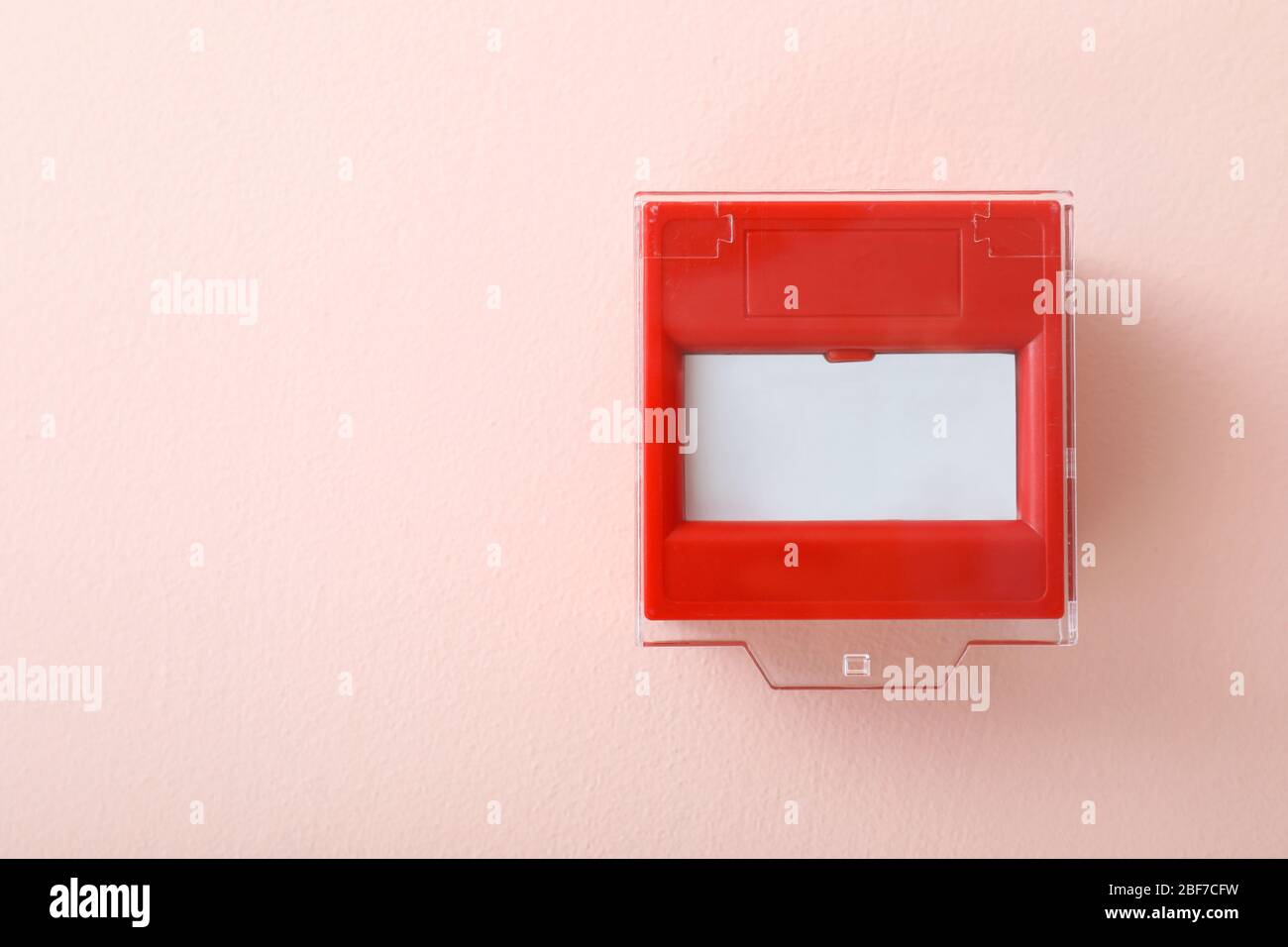 Modern manual call point on color background Stock Photo - Alamy