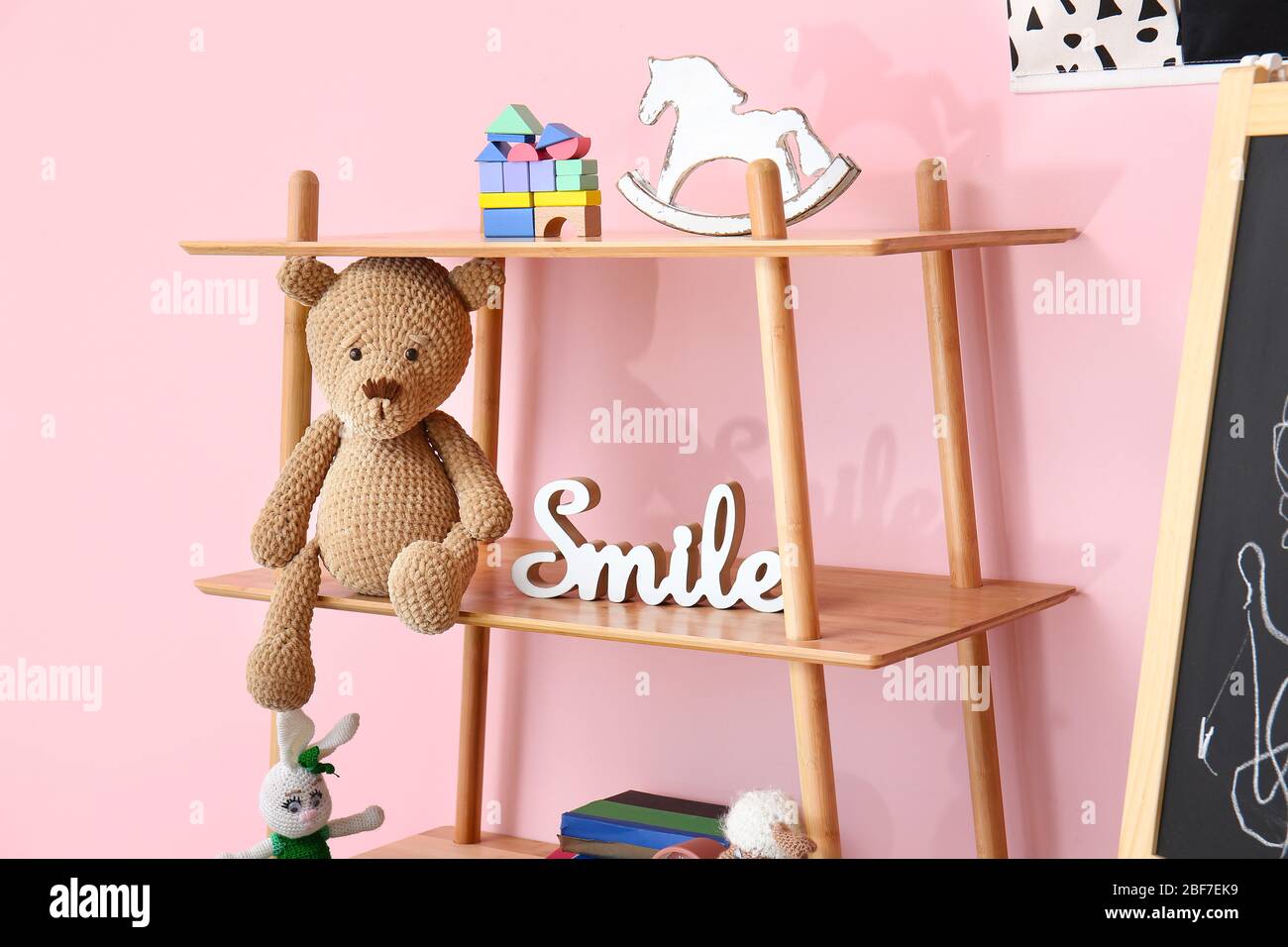 Cuddly toy on shelf in children's room Stock Photo Alamy
