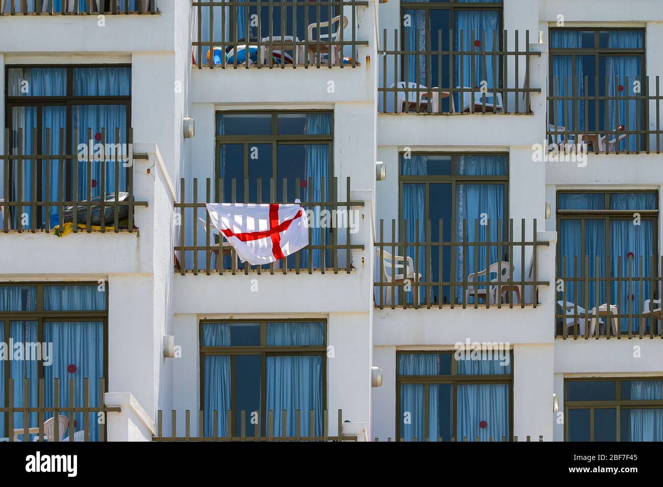 Cross of St George flag on a holiday balcony in  Majorca, Spain. Stock Photo