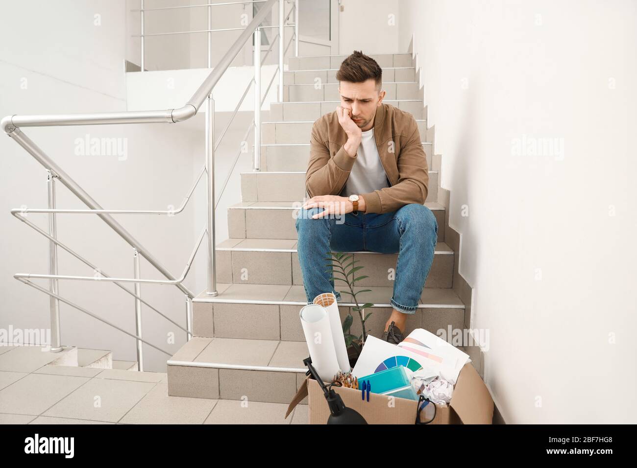 Sad fired man sitting hi-res stock photography and images - Alamy