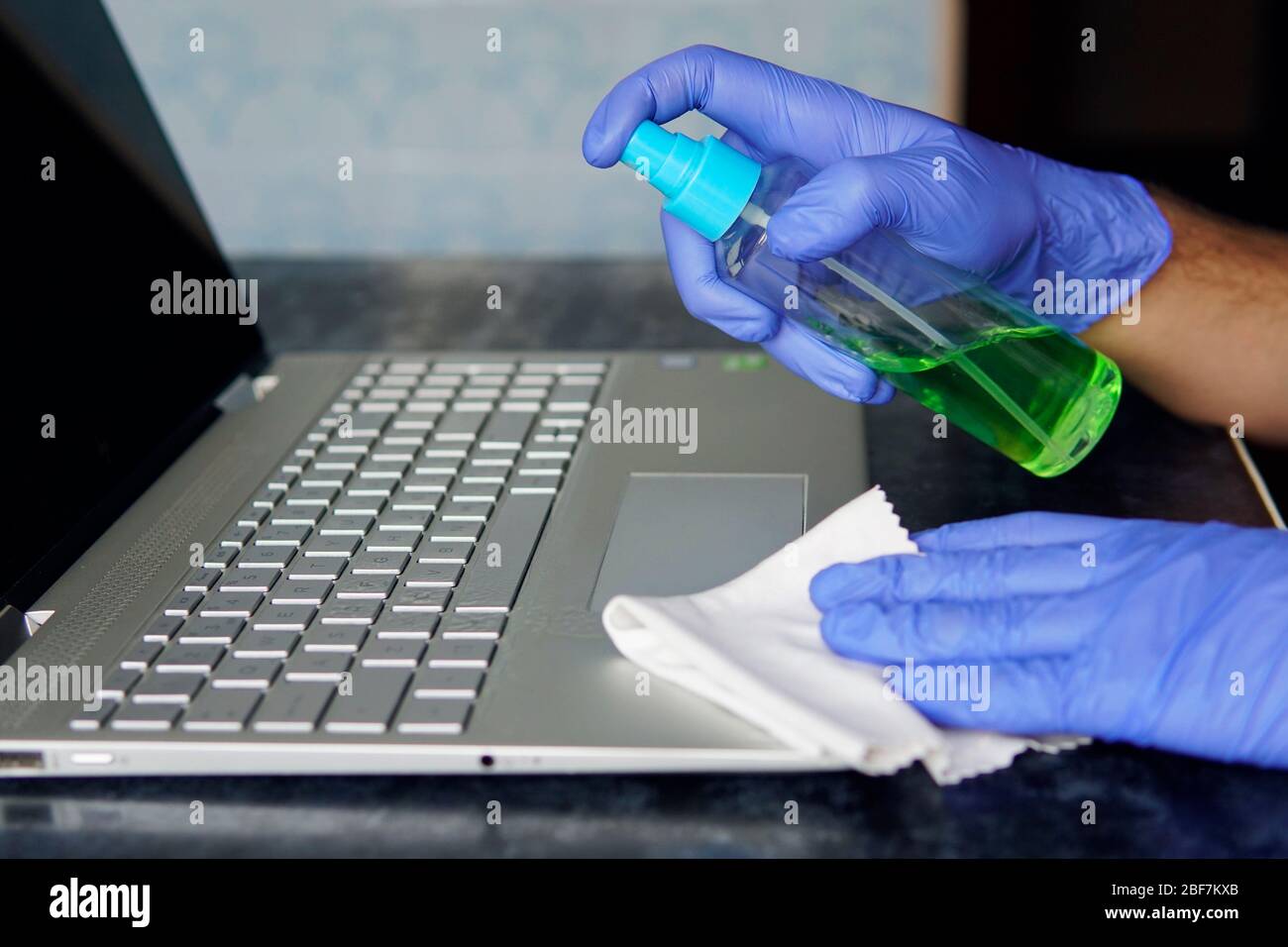 man panic cleaning notebook laptop pc. cleaning the dust from the keys