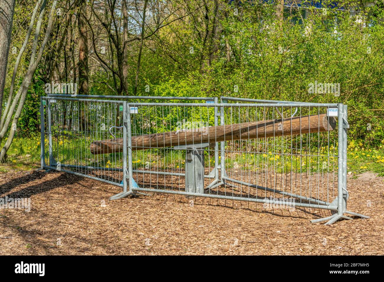 Britzer Garten, Berlin, Germany - april 16, 2020: due to the Corona crisis locked teeter totter Stock Photo