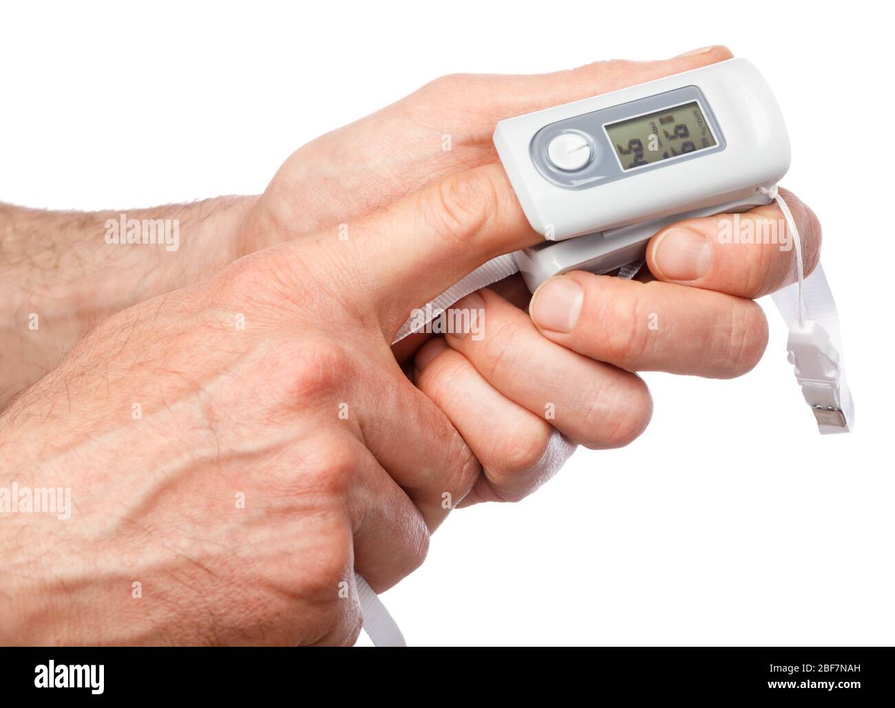 Close-up shot of person using finger pulse oximeter to check oxygen saturation and heart rate tracking coronavirus symptoms - epidemic virus outbreak Stock Photo