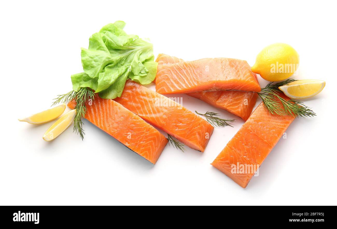 Raw salmon fillet with herbs and lemon on white background Stock Photo ...