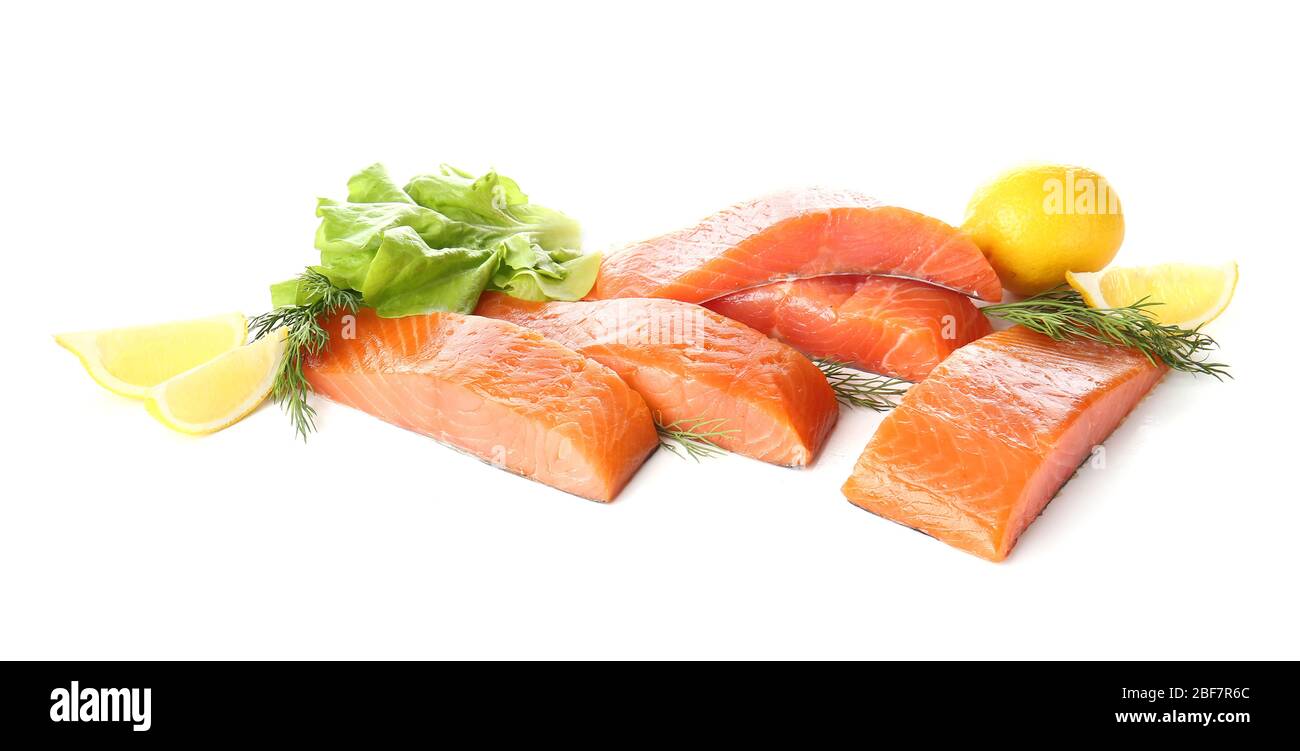 Raw salmon fillet with herbs and lemon on white background Stock Photo ...