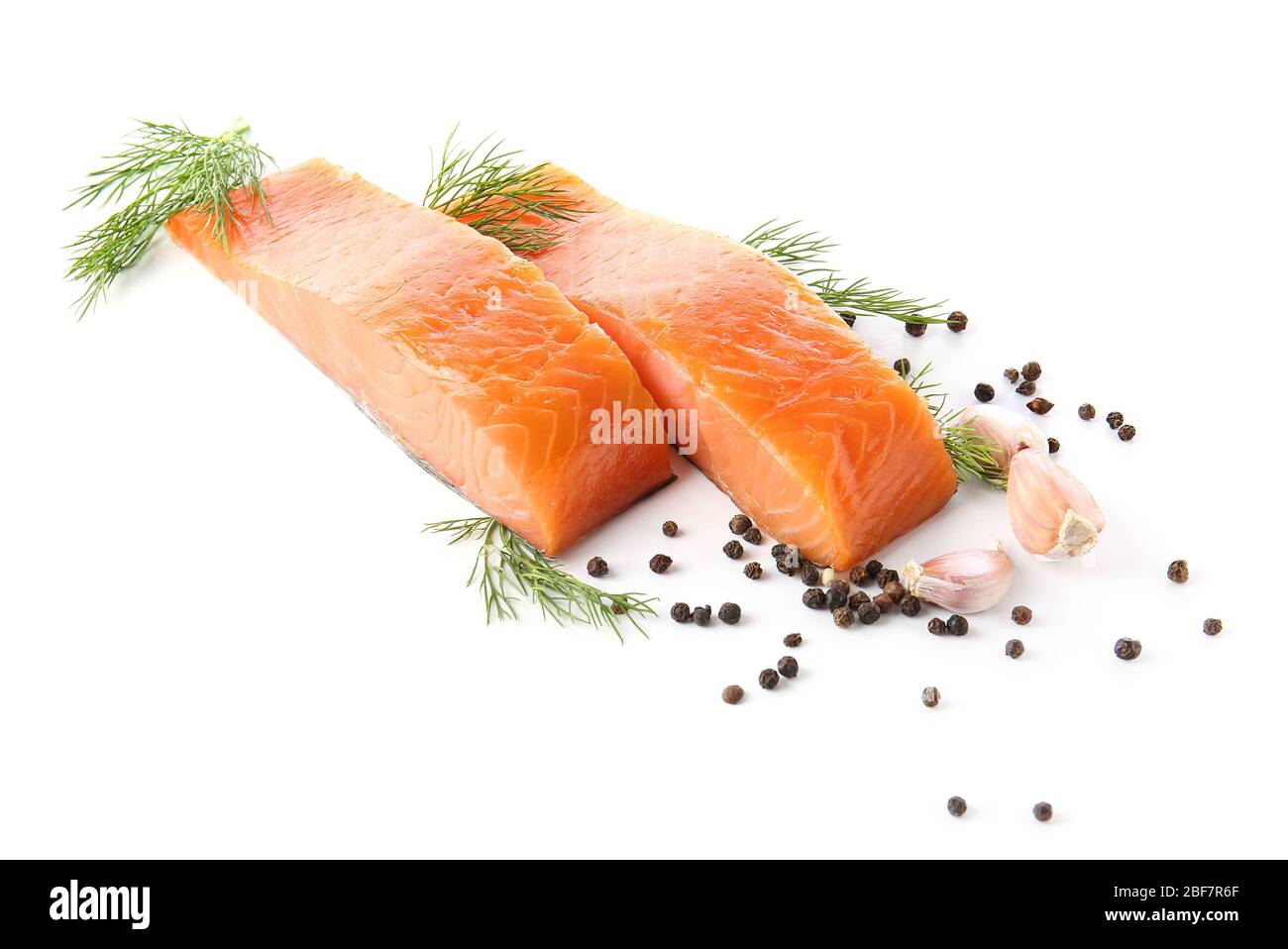 Raw salmon fillet with spices on white background Stock Photo - Alamy
