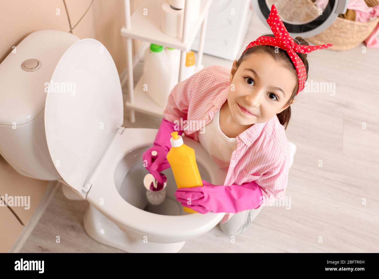 Cute eight year old girl in the bathroom Stock Photo