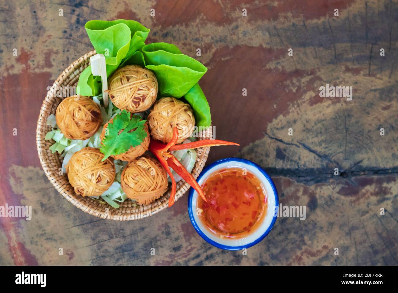 Deep fried wrapped pork with noodle, traditional thai food Stock Photo