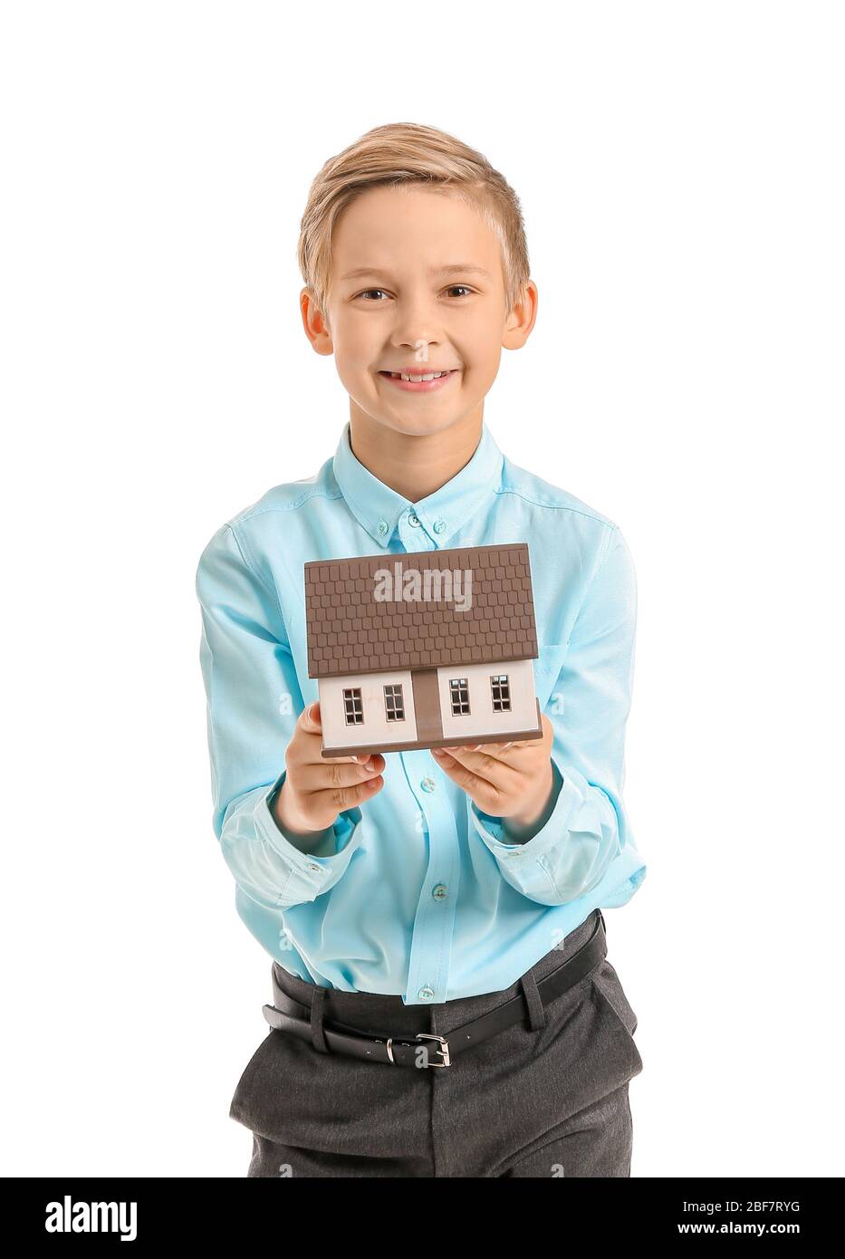 Portrait of little real estate agent with model of house on white background Stock Photo Alamy