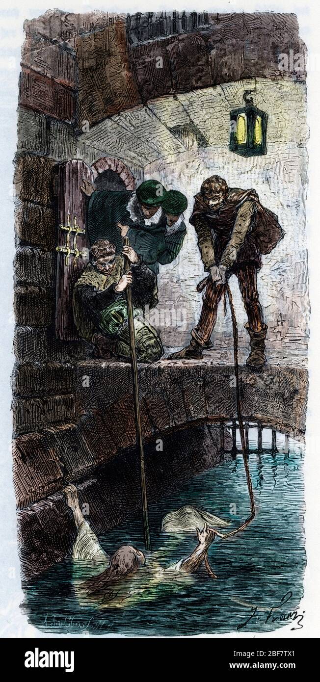 Chasse aux sorcieres : une femme, presumee sorciere, est soumise a l'epreuve de l'eau (ordalie), si elle flotte elle estt condamnee (Water-ordeal (wat Stock Photo