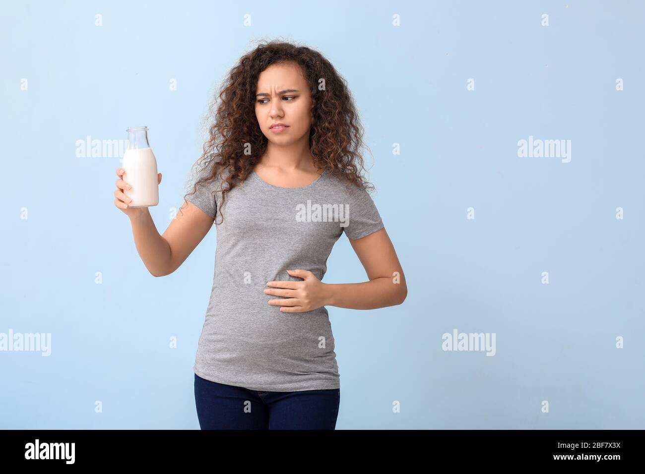 Young pregnant AfricanAmerican woman with dairy allergy on color