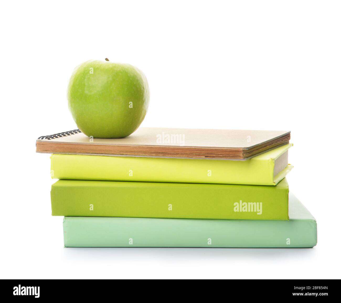School books and apple on white background Stock Photo - Alamy