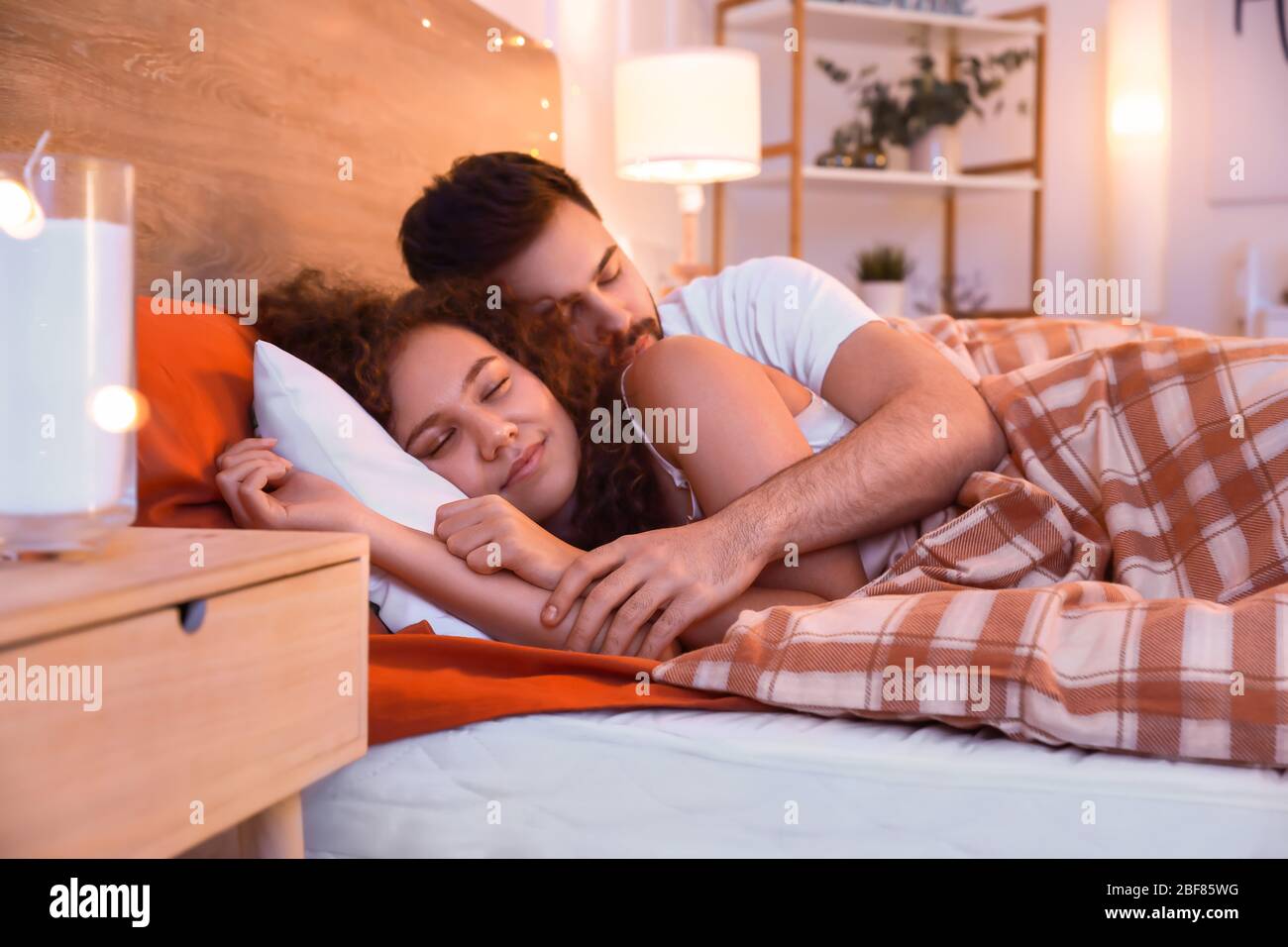 Happy Young Couple Sleeping In Bed At Night Stock Photo Alamy https www alamy com happy young couple sleeping in bed at night image353607452 html