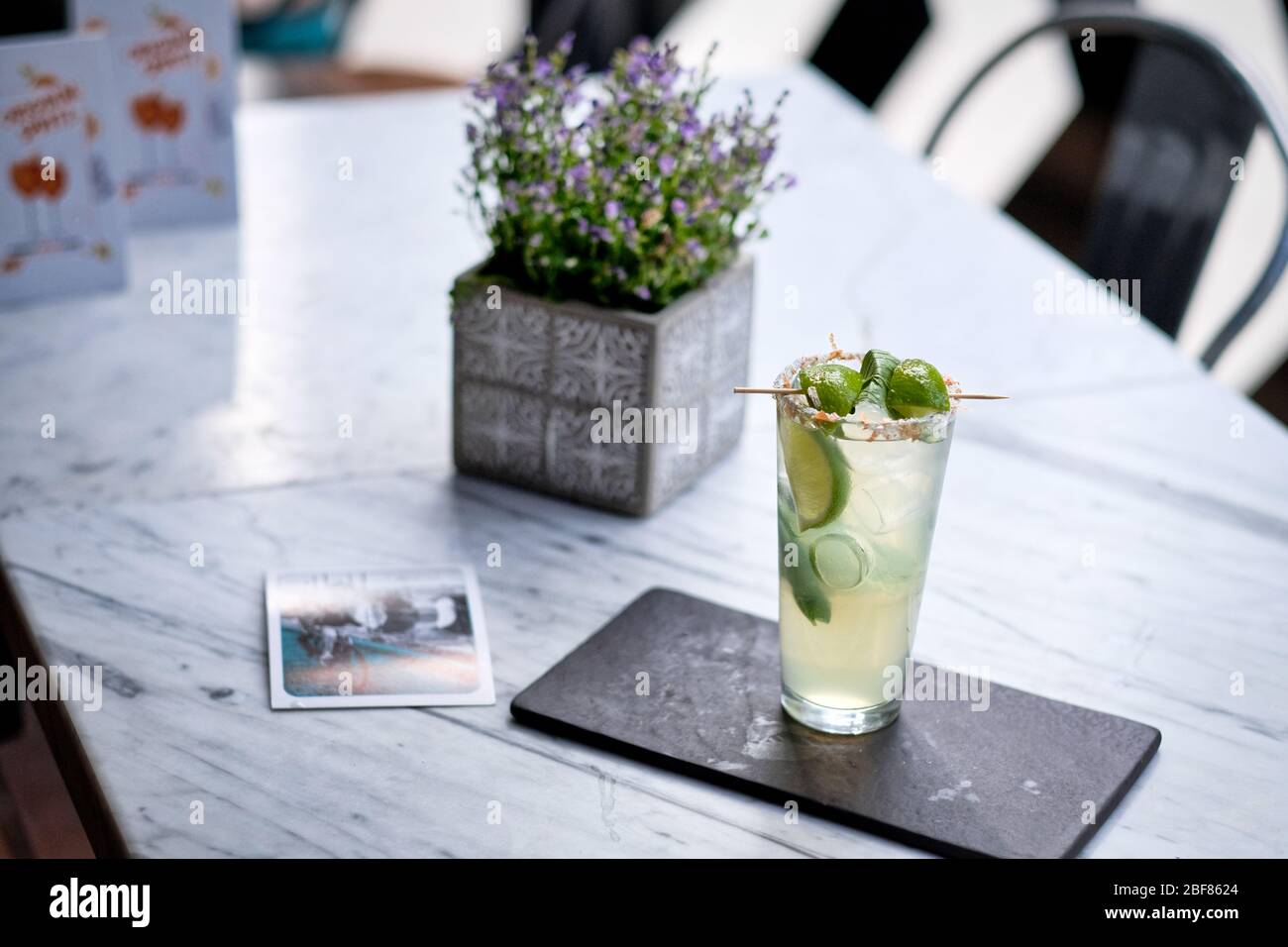 Refreshed Mojito cocktail with Cookie on the marble table. Summer exotic colorful cocktail Stock Photo