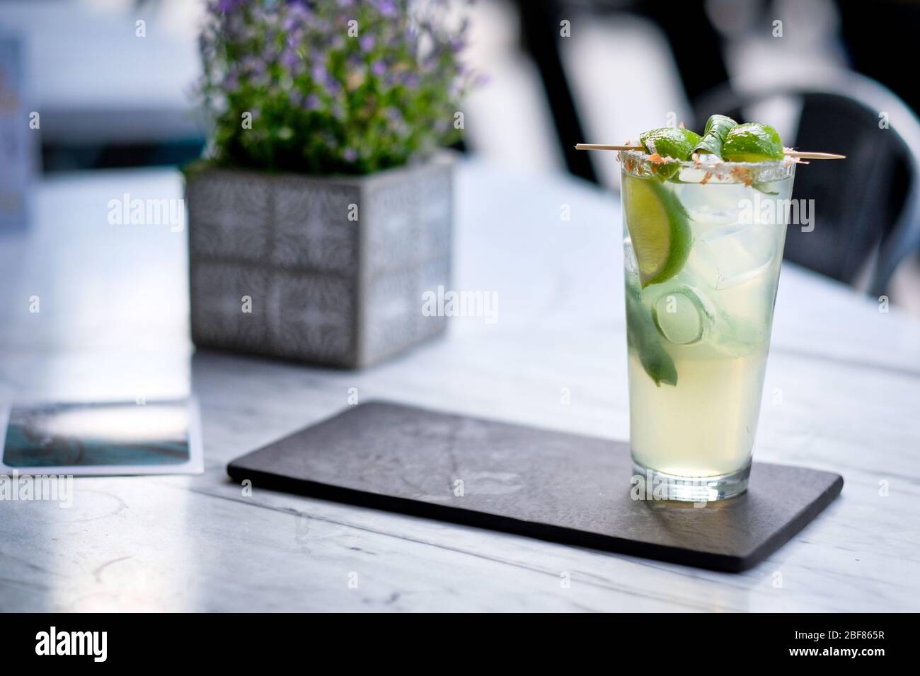 Refreshed Mojito cocktail with Cookie on the marble table. Summer exotic colorful cocktail Stock Photo